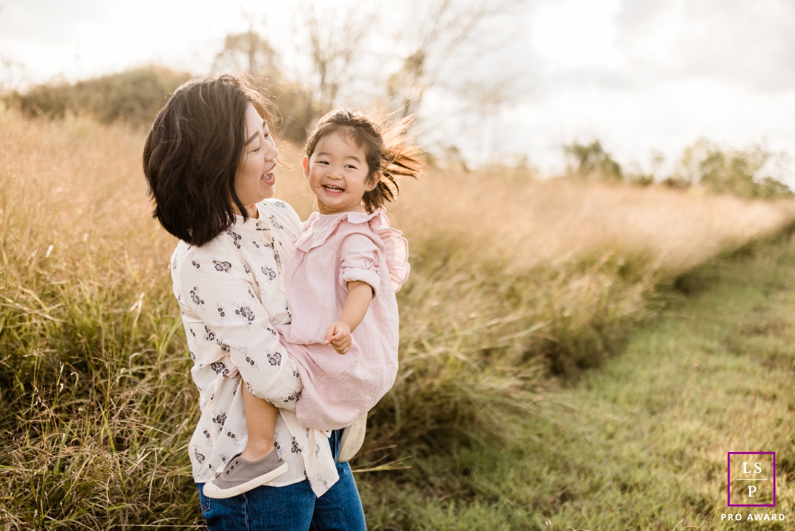 A modern Houston lifestyle photography session that documented this Texas mom carrying her daughter