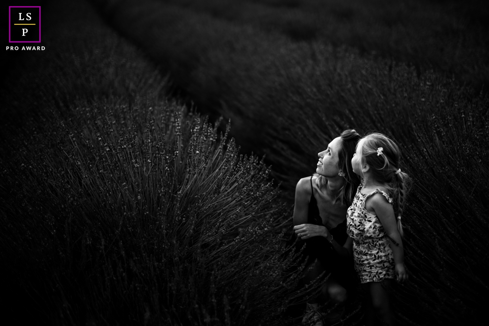A modern image from Biarritz to help define lifestyle photography by showing a mom and daughter in nice light in some BW lavender fields