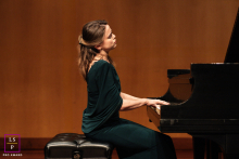 Pianist Gretchen Hull Appears Lost In Warm Stage Light At Piano In San Jose, California Portrait At the piano in San Jose, California, Gretchen Hull appears lost in the music. Warm stage tones, elegant posture, and generous negative space give the portrait the quiet gravity of a live performance.