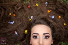 Lisbon Teen Lifestyle Portraits for Portugal - Photo contains: senior, girl, flowers, face, hair, grass, color, picture, close-up