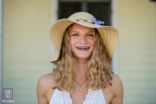 A Teen Senior Lifestyle Portrait Session with a young woman wearing a hat and smiling for the camera Key West Teen / Senior Lifestyle Portrait Session | Photo contains: Florida, fine art, girl, close-up, outdoors, house, hat, hair, color