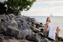 Teen Lifestyle Portrait on the rocks near the ocean with sail boats Key West Teen Lifestyle Portraits - Photo contains: rocks, beach, senior, portrait, color, shot, posing, tree, ideas