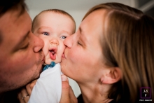 At home Netherlands lifestyle baby portrait session in Groningen with a squishy baby face