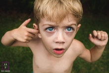 lifestyle picture of a boy with his finger in his ear This is a lifestyle picture of a boy with his finger in his ear in Mato Grosso do Sul, Brazil