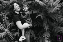 lifestyle photo of a young child in the ferns with mom in BW This is a lifestyle photo from Doubs of a young child in the ferns with mom in BW