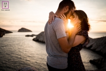 This is a lifestyle picture of a Couple during golden hour embracing above the beach at Marseille