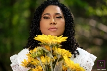 Artistic Knoxville lifestyle solo portrait photography Showing her face while holding beautiful sunflowers Artistic Knoxville lifestyle solo portrait photography Showing her face while holding beautiful sunflowers