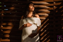 Maceio lifestyle maternity session from a portrait shoot that captured a pregnant woman between shadows and hard light