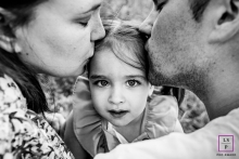 A modern image from Ardeche to help define lifestyle photography by showing the girl enjoying the Feel of love from her parents