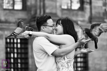 A modern image from Netherlands to help define lifestyle photos by showing a Happy couple with the pigeons