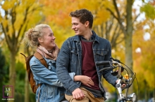 A Utrecht lifestyle photography shoot portraying a slice of life with a Couple riding bicycles in the fall time