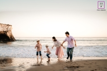 A San Jose lifestyle photography shoot portraying a family slice of life while playing at the beach and chasing waves A San Jose lifestyle photography shoot portraying a family slice of life while playing at the beach and chasing waves