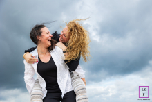 Sisters enjoying the beauty of North Holland, with windswept hair and big open skies. Love captured by a talented lifestyle photographer.