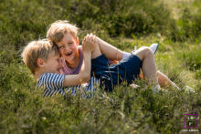 Brotherly Bond - Captured in North-Holland, this portrait captures the true essence of the bond between two brothers as they choose play over posing for a photo. 