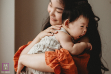 In Markham, Ontario, a mother holds her baby close, unwilling to let go. He is her everything, and she gives him all her love and care.