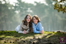 In Noord-Holland, The Netherlands, a brother and sister share a timeless photo session in nature, creating a cherished keepsake for their parents.