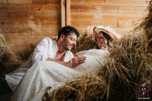 In Poleymieux-au-Monts-d'Or, Rhône, a tender scene unfolds as he touches her belly while they lie together in the hay.
