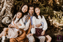 Hayward, California: A tight-knit family poses together in the park, radiating warmth and togetherness.