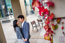 High-angle portrait of a couple standing face-to-face inside a campus building at UC Berkeley.