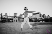 Airborne Leap Expresses Freedom and Energy in Black and White Industrial Montreal, Canada Solo Portrait Against the open industrial landscape of Montreal, this airborne leap feels less like movement and more like temporary freedom from gravity itself. The black and white treatment and wide negative space give the photo striking energy and modern simplicity.