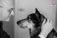 Capturing the bond between man and his aging dog in this intimate black and white portrait, showcasing the love that lasts a lifetime. Photographed in Oakland, California.