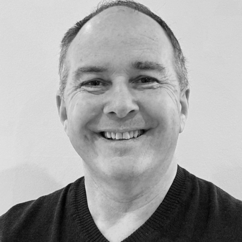 Black and white studio portrait of Dave Nelson, lifestyle photographer based in Lancashire, England