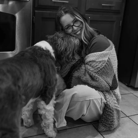 Ashley Connors, Austin lifestyle photographer, shares a warm, candid image at home with her dog.