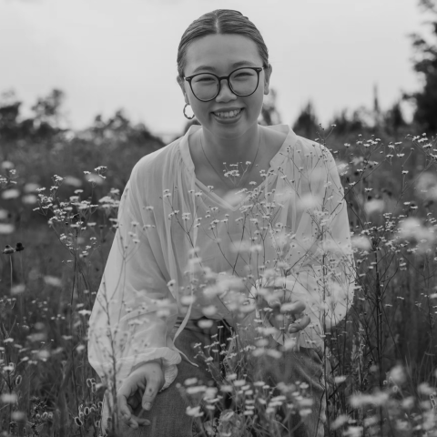 Iris Chen, lifestyle photographer in Augusta, Georgia, photographed in a field of flowers Outdoor portrait of Iris Chen, Augusta lifestyle photographer, in a field of flowers